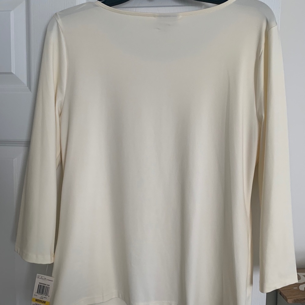 Cream colored top. New with tags.